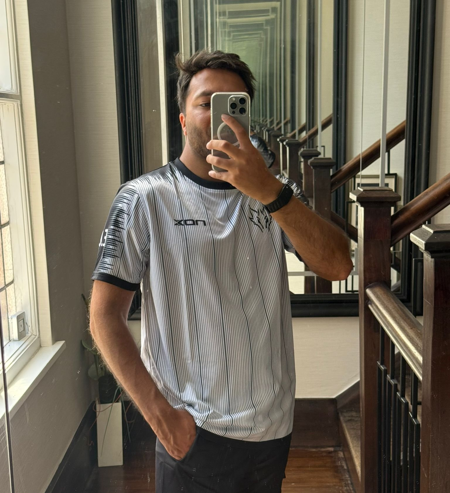 Los Dragos fan in white pinstripe kit